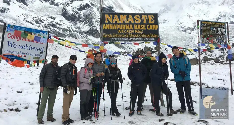 Happy trekkers are ready for a group photo at Annapurna base camp