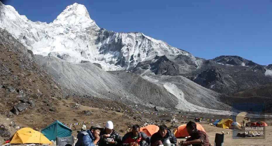 Climbing guides are enjoying their meal at the Ama Dablam climbing base camp
