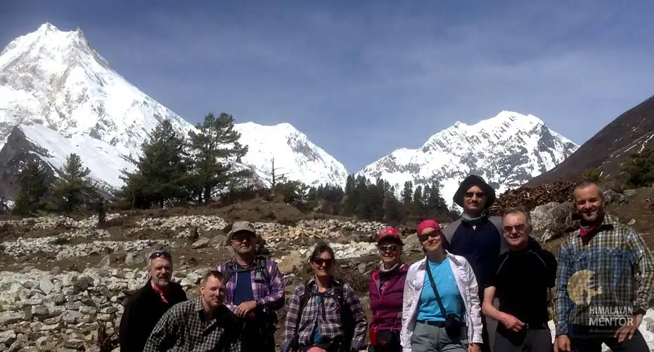 Happy clients are ready for a photograph & Mt. Manaslu in the background