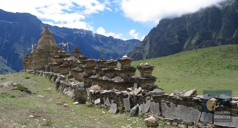 Buddhist Chorten and carving along the way to the village
