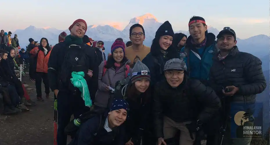 Group photo at Poon Hill (3210m.) during the sunrise hike from Ghorepani