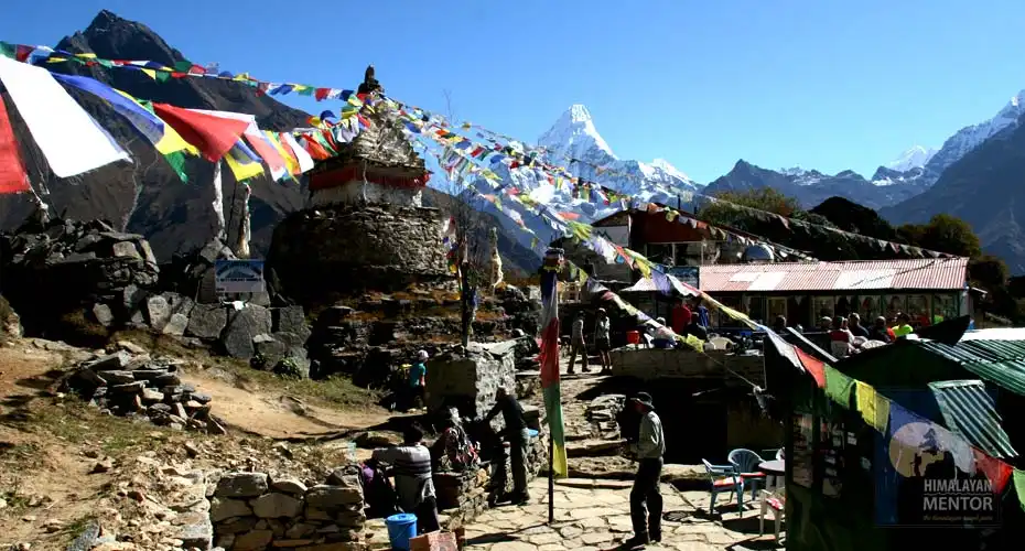 Mt. Amadablam, Buddhist prayer flags and the tea house for a lunch break one the way to Tengboche