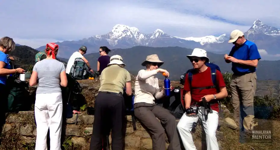 Hikers are taking a drinks break and enjoy the incredible views too